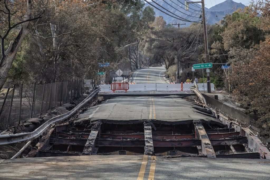 Damaged Bridge along Mulholland HIghway, the steel beams melted from the extreme heat. The Woolsey wildfire started on November 8, 2018 and has burned over 98,000 acres of land, destroyed an estimated 1,100 structures and killed 3 people in Los Angeles and Ventura counties and the especially hard hit area of Malibu. California, USA